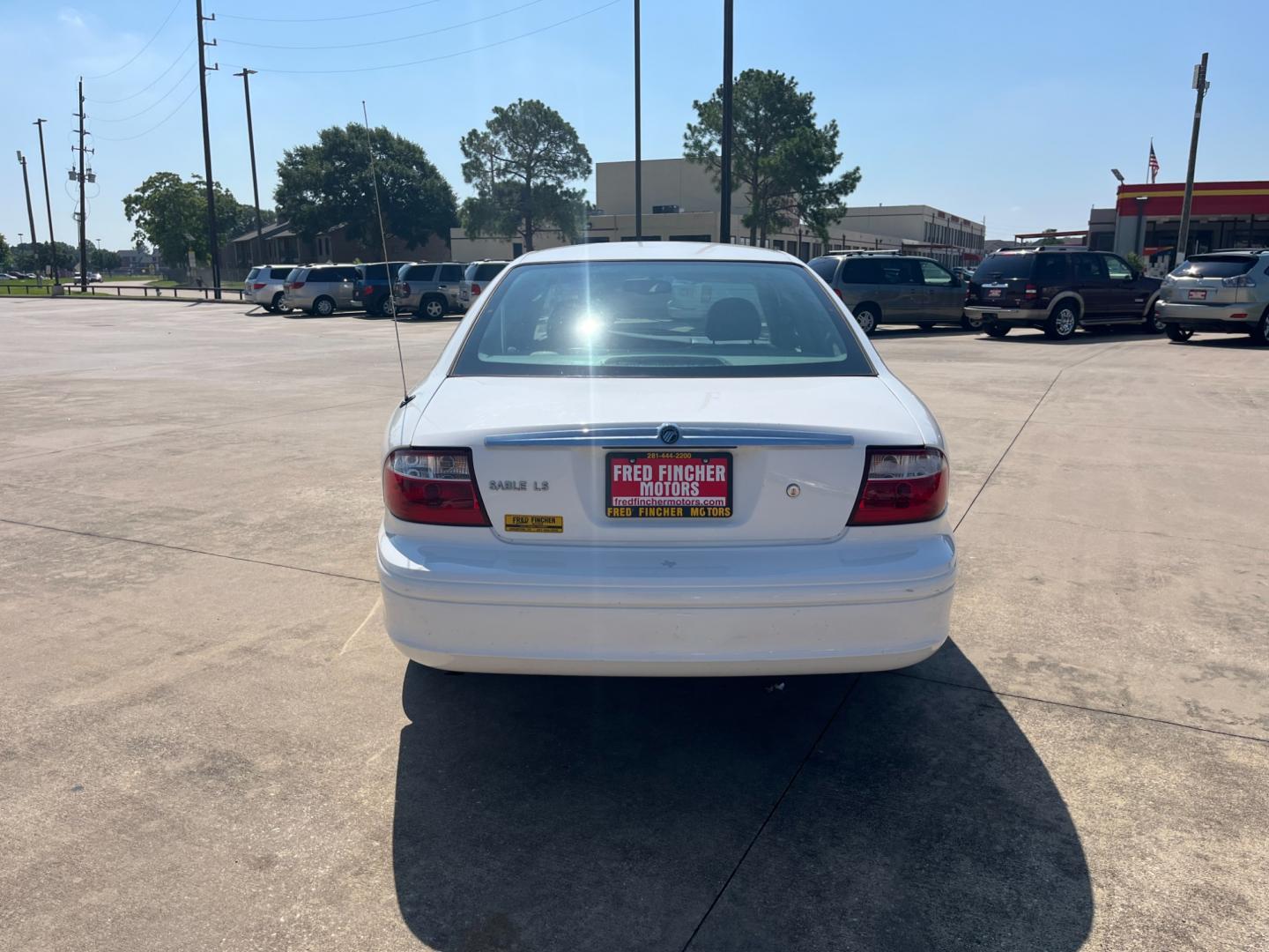 2004 white /TAN Mercury Sable LS Premium (1MEHM55S54A) with an 3.0L V6 SOHC 24V engine, 4-Speed Automatic Overdrive transmission, located at 14700 Tomball Parkway 249, Houston, TX, 77086, (281) 444-2200, 29.928619, -95.504074 - Photo#5